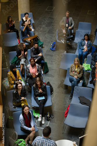 Conference audience watching speakers on stage