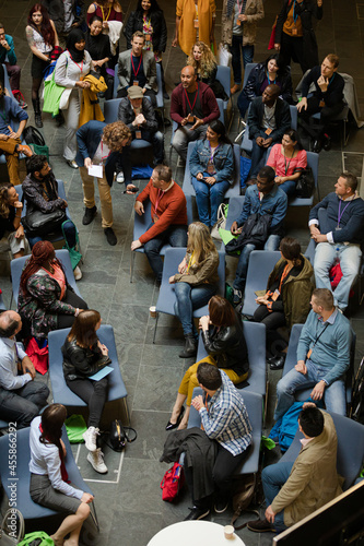 Conference audience watching speakers on stage