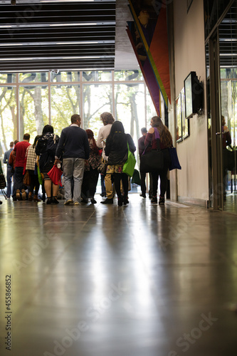 People talking in hall of auditorium