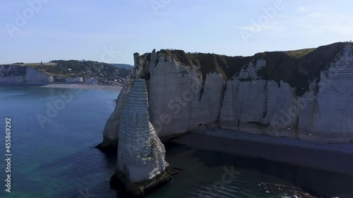 Warpspeed Effect. Aerial speedramp circle shot starting lockdown of a chalk rock revealing the village of Etretat France Normandy on a sunny day photo