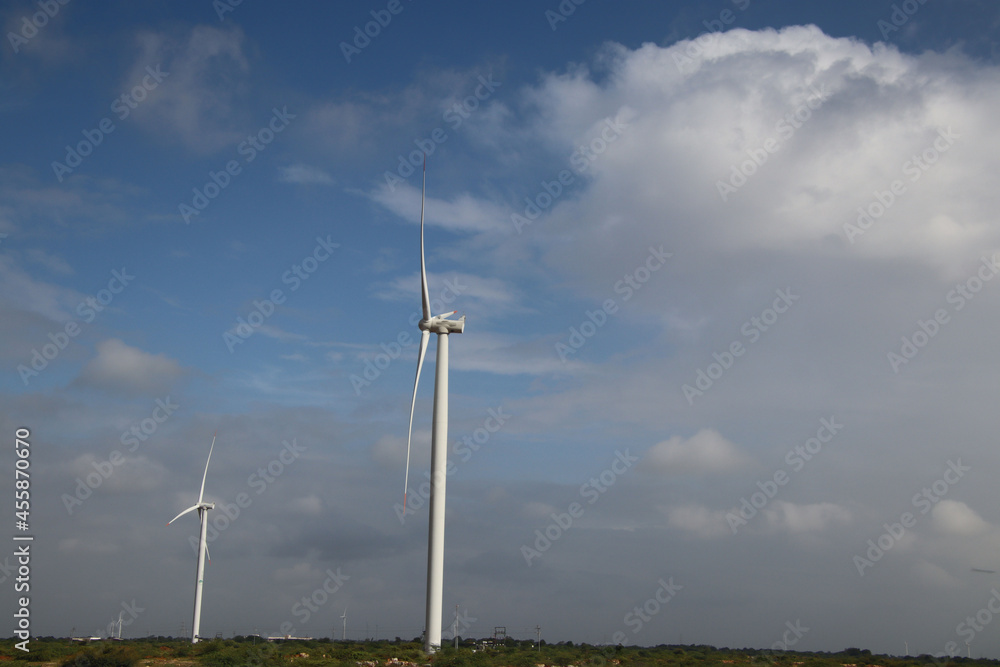 windmill generates electricity green trees and white clouds natural scenery windmill generates electricity green trees and white clouds natural scenery