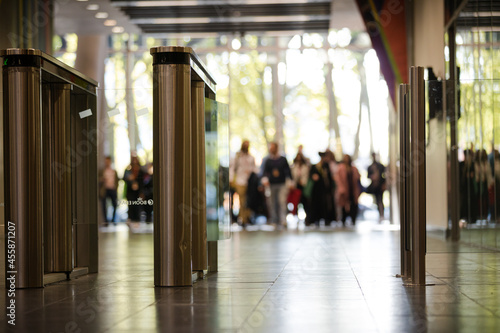 People entering auditorium hallway