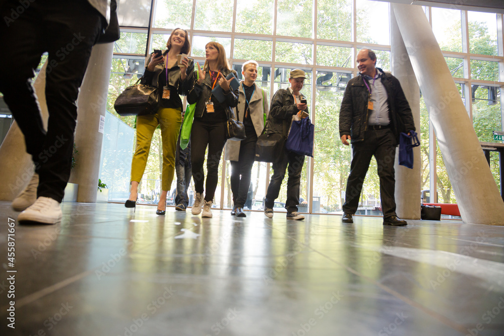Fototapeta premium People entering auditorium hall