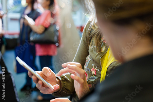 Business people using smart phone in conference audience