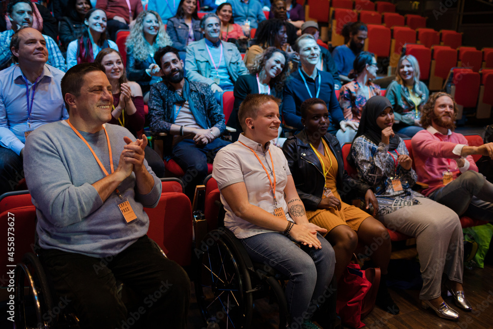 Smiling, happy audience clapping Smiling, happy audience clapping