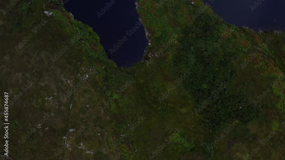 Ringfort, Doon Lough, Portnoo, County Donegal, Ireland, September 2021. Drone birds-eye view, tracking north-west above the island-fort. Ringfort, Doon Lough, Portnoo, County Donegal, Ireland, September 2021. Drone birds-eye view, tracking north-west above the island-fort.