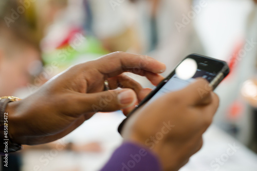 Man using phone in auditorium hall