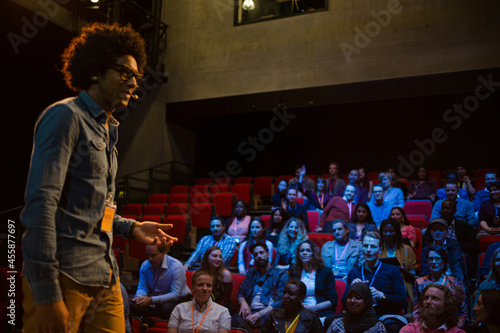 Wallpaper Mural Male speaker on stage talking to audience Torontodigital.ca