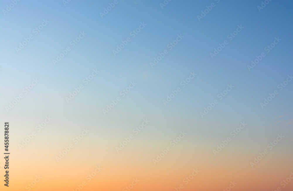 Sky background. A blue sky landscape illuminated by the light of an evening sunset - a view of the evening sky.