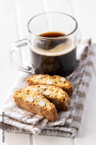 Italian cantuccini cookies and coffee cup. Sweet dried biscuits with almonds