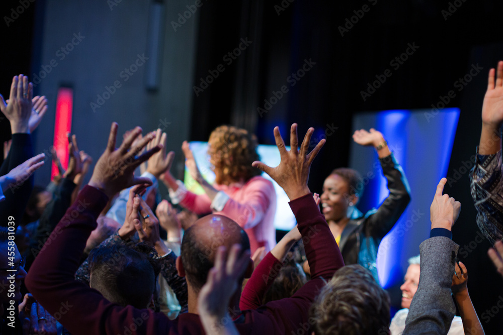 Fototapeta premium Audience reaching for and talking with speakers