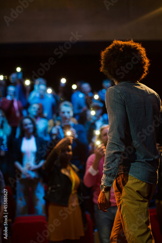 Male speaker with microphone talking to audience