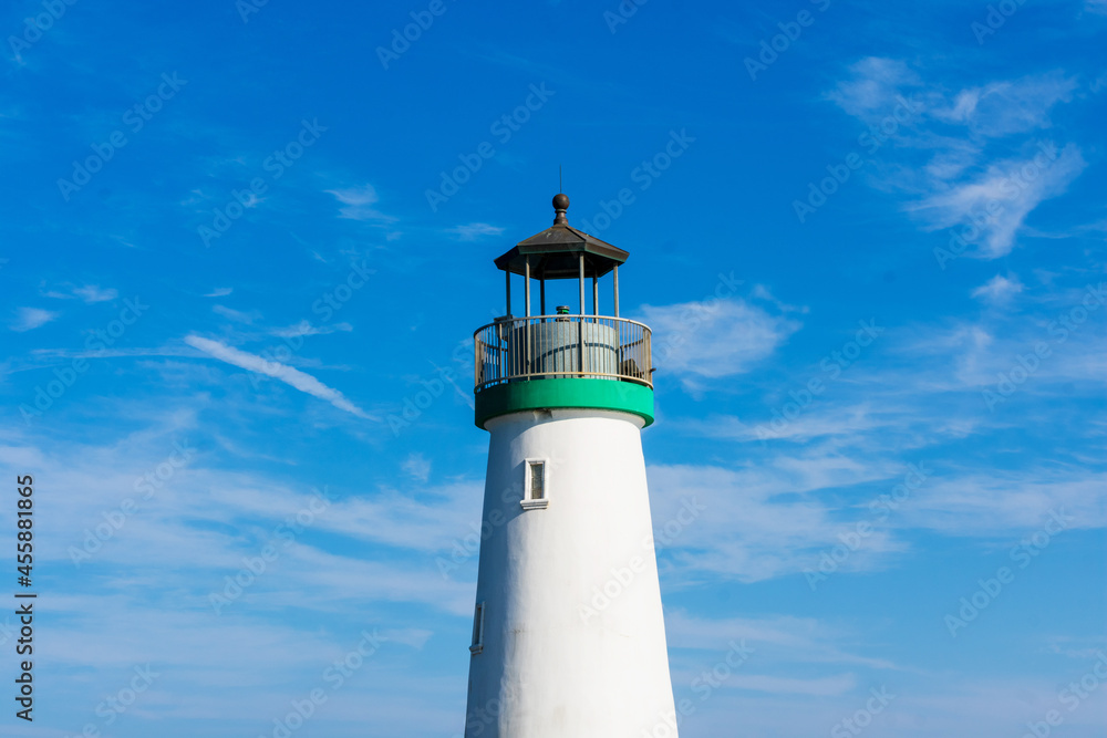 Top of Santa Cruz breakwater lighthouse. Beautiful sky background Top of Santa Cruz breakwater lighthouse. Beautiful sky background