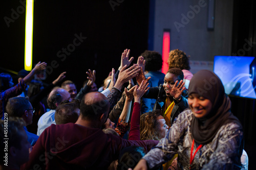 Audience reaching for and talking with speakers