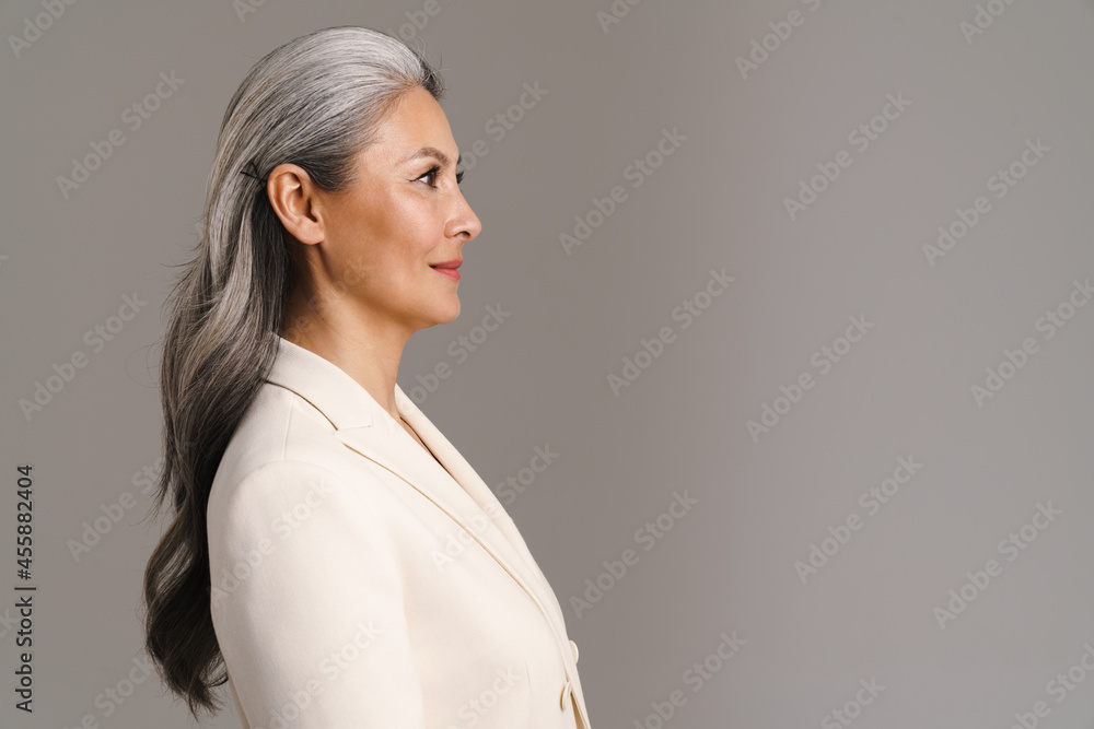 Mature asian woman with white hair posing in profile Mature asian woman with white hair posing in profile