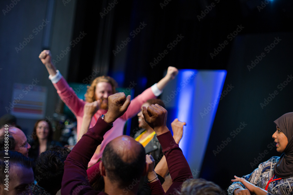 Fototapeta premium Audience reaching for and talking with speakers