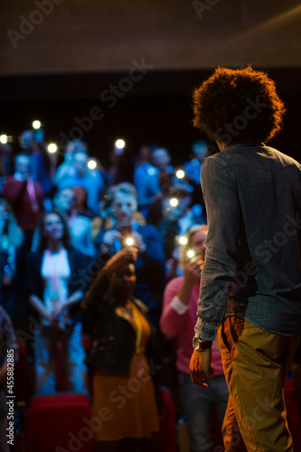 Male speaker with microphone talking to audience