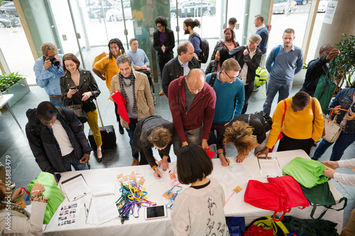 People signing up for conference