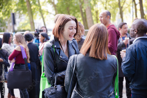 People talking outside auditorium