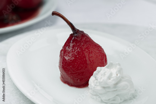 Pear poached in red wine, dessert photo