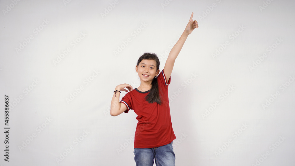 beautiful little girl pointing up blank space isolated on white background