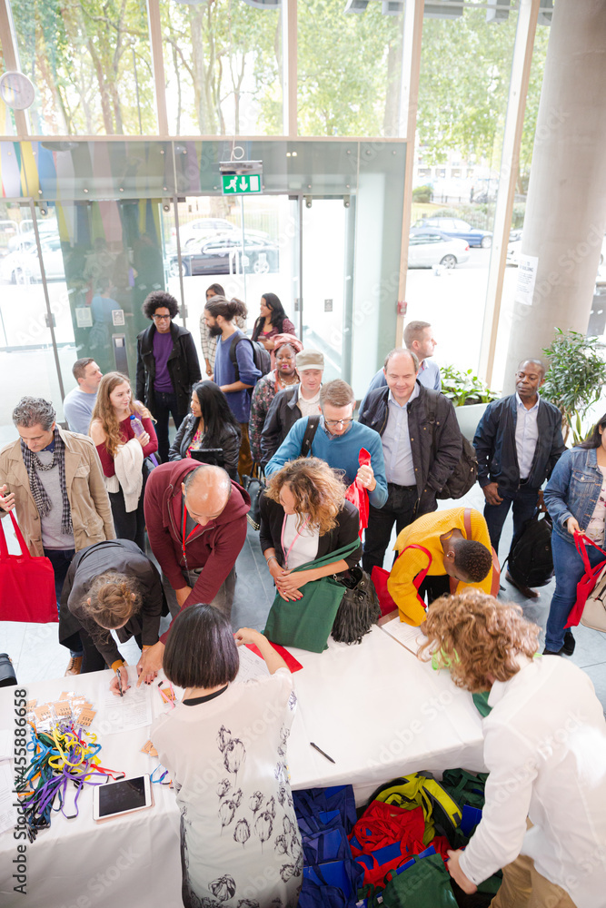 Fototapeta premium People signing up for conference