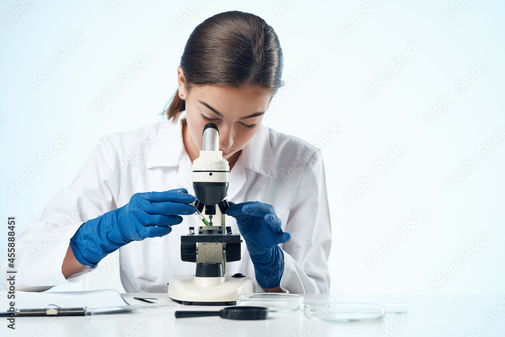 woman laboratory assistant microscope microbiology research woman laboratory assistant microscope microbiology research