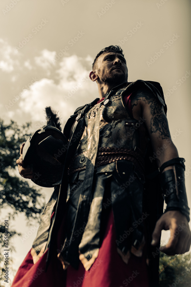 Portrait of ancient Spartan warrior in battle dress with helmet. Portrait of ancient Spartan warrior in battle dress with helmet.