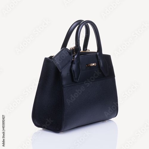 Black handbag isolated with white background. Fancy female bag.