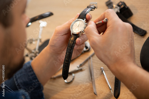 a watchmaker or repair man in action