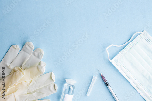 vaccine on a vial bottle and injection Syringe on a white table