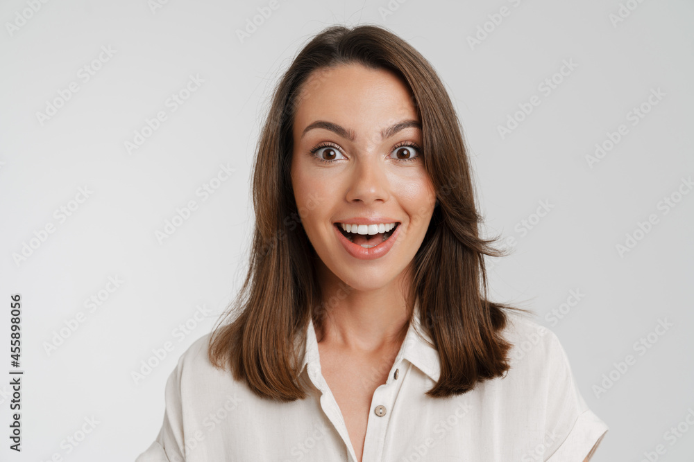 Young european woman expressing surprise at camera Young european woman expressing surprise at camera
