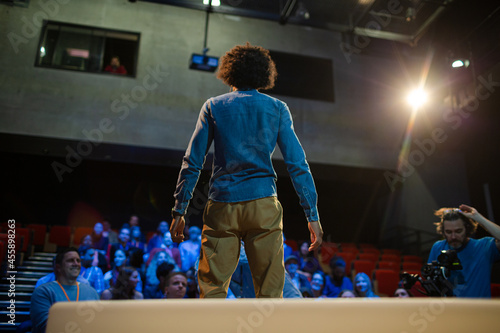 Audience watching speaker on stage