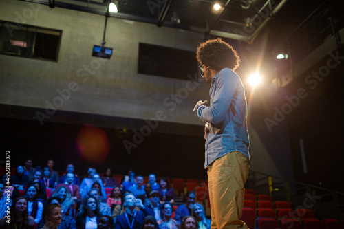 Audience watching speaker on stage © KOTO
