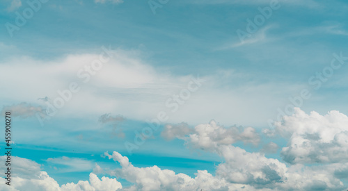 Cloudscape of white stratocumulus clouds on blue sky. Full Frame of white fluffy clouds texture background. Heaven sky with daylight. Beauty in nature. Summer sky. Pure white clouds. Freedom concept. photo