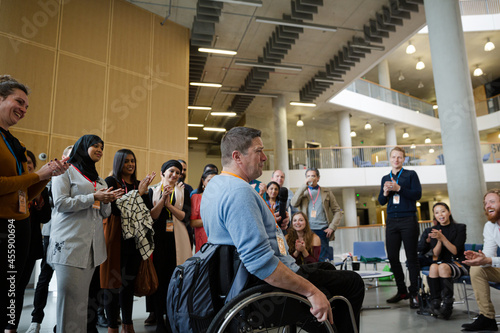 Speaker in wheelchair talking to audience