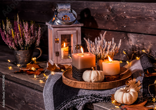 Beautiful autumn terracce decoration with pumpkins, lantern, plants and flowers photo