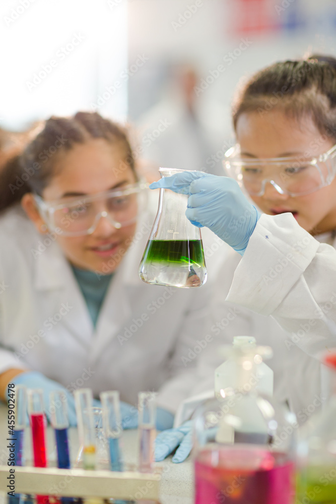 Students watching chemical reaction, conducting scientific experiment in laboratory classroom Students watching chemical reaction, conducting scientific experiment in laboratory classroom