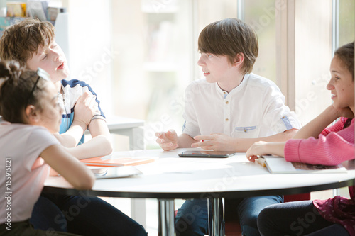 Students sitting together at table