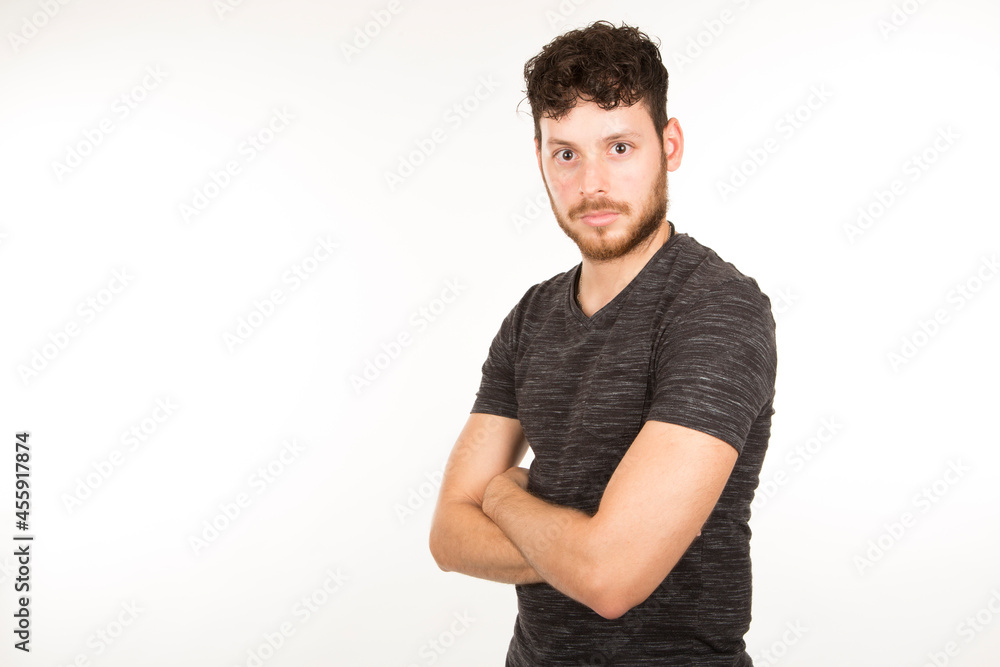 portrait isolated caucasian young man with serious expression with crossed arms portrait isolated caucasian young man with serious expression with crossed arms