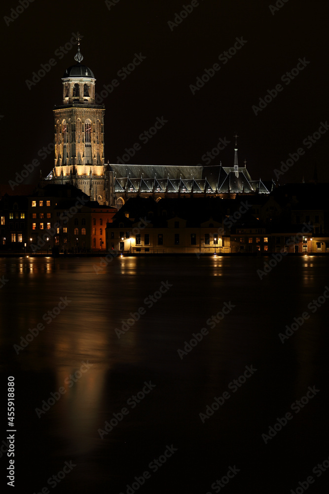 The Great Church in the City of Deventer, the Netherlands, at night with reflection in the water