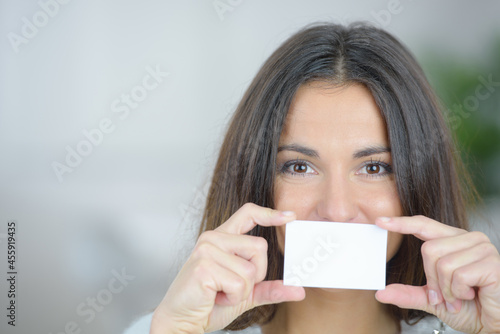 a woman is holding a secret