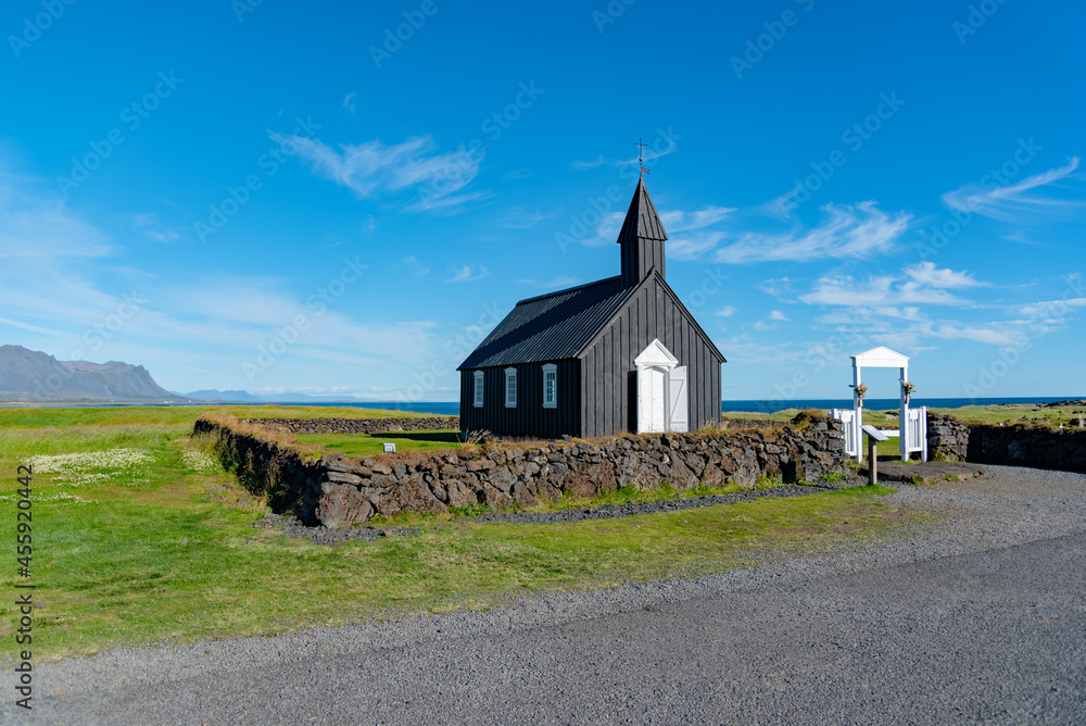 Black wooden church in the countryside