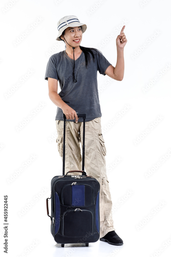 Isolated studio shot of Asian happy long hair ponytail male adventure traveler standing pointing on blank space for ads holding trolley traveling luggage for holiday vacation on white background Isolated studio shot of Asian happy long hair ponytail male adventure traveler standing pointing on blank space for ads holding trolley traveling luggage for holiday vacation on white background