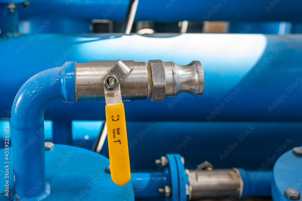 View of the one inch ball valve with pipe connection. A ball valve is a flow control device which uses a hollow, perforated and pivoting ball to control liquid flowing through it.