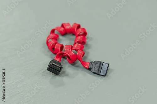 sata cable on a light background, computer cable red photo