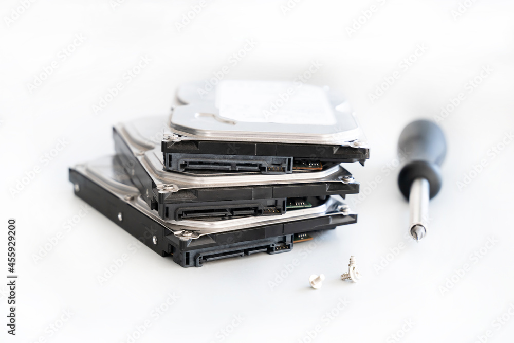 hdd disk repair with screwdriver and bolts disk repair on light background hdd disk repair with screwdriver and bolts disk repair on light background