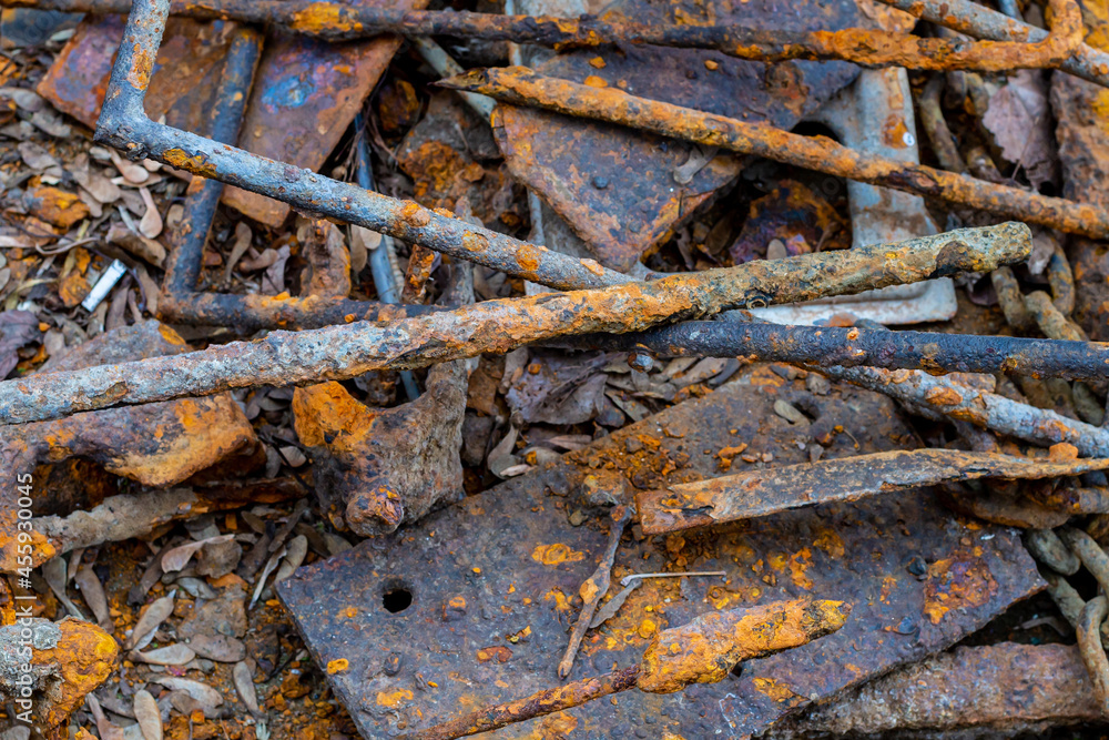 steel bar and plate covered with rusty on the ground close up steel bar and plate covered with rusty on the ground close up