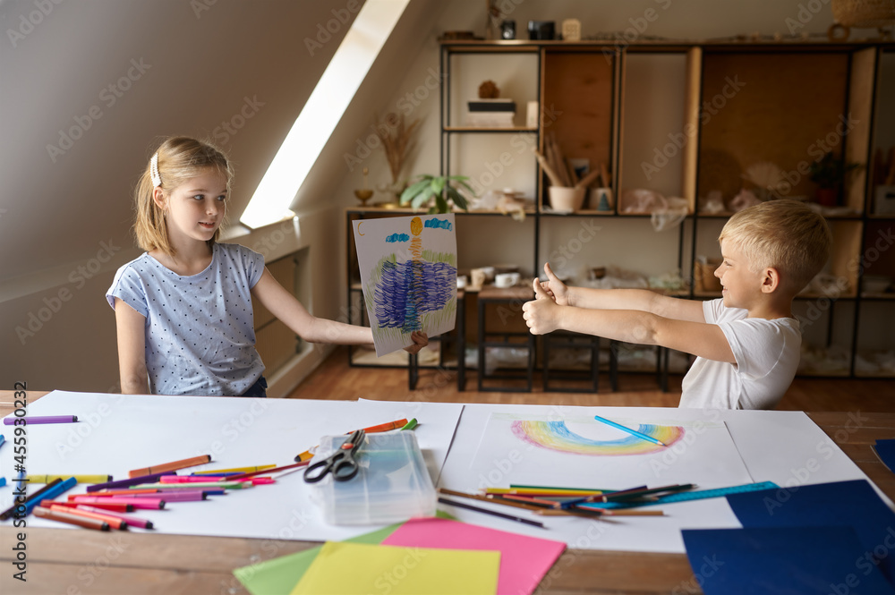 Two children at the table in drawing class Two children at the table in drawing class
