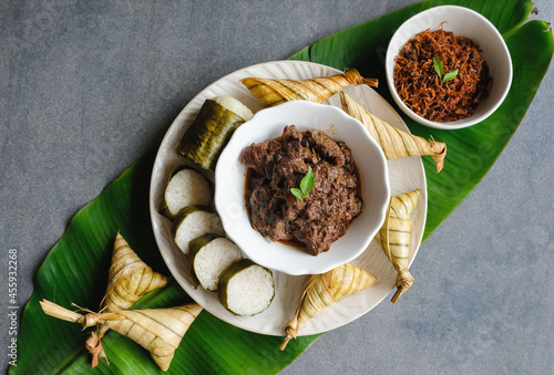 Popular food for breaking fast during Ramadan. Ramadan Food. Food like lemang, ketupat palas, beef and chicken rendang and serunding are commonly eaten together photo